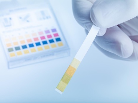 laboratory-technician-working-with-test-strips-indicator-paper-ph-testing-concept